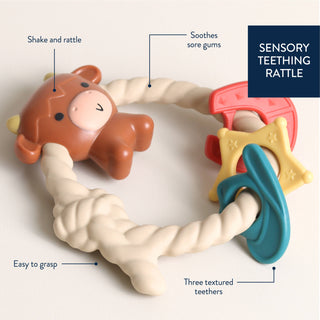 Ritzy Rattle™ Silicone Teether with Rattle | Highland Cow | Itzy Ritzy